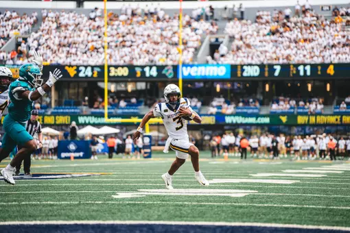 Quarterback Michael Hawkins Jr. (3) scores his first career rushing touchdown as a Mountaineer in the fourth quarter against Coastal Carolina on Sept. 5, 2026.