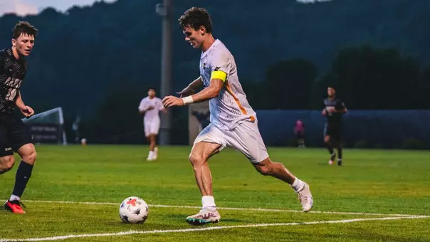 Isaac Scheer in action for West Virginia men's soccer against Akron