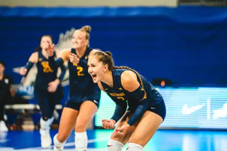 Mirjam Kask celebrates following a point during a match.