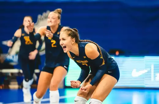 Mirjam Kask celebrates following a point during a match.