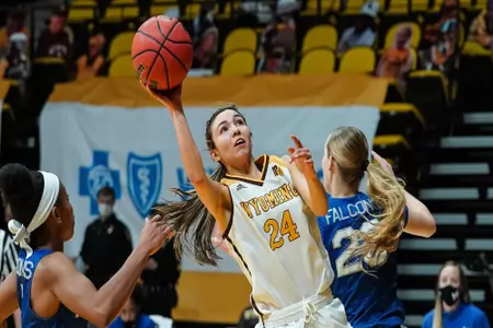 Jan 16, 2021; Laramie, WY, USA; Wyoming Cowgirls guard Tommi Olson (24) shoots against the Air Force Falcons at Arena-Auditorium. Mandatory Credit: Troy Babbitt-UW Media-Athletics