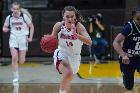Feb 13, 2021; Laramie, WY, USA; Wyoming Cowgirls guard Quinn Weidemann (14) against the Utah State Aggies at Arena-Auditorium. Mandatory Credit: Troy Babbitt-UW Media-Athletics