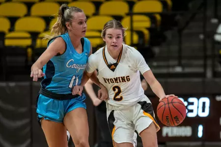 Oct 28, 2022; Laramie, WY, USA; Wyoming Cowgirls guard Emily Mellema (2) drives against the Colorado Christian Cougars at Arena-Auditorium. Mandatory Credit: Troy Babbitt-UW Media-Athletics