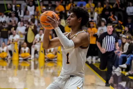Nov 10, 2022; Laramie, WY, USA; Wyoming Cowboys guard Brendan Wenzel (1) looks to pass against the Nicholls State Colonels at Arena-Auditorium. Mandatory Credit: Troy Babbitt-UW Media-Athletics