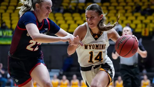 Nov 15, 2022; Laramie, WY, USA; Wyoming Cowgirls guard Quinn Weidemann (14) against the Gonzaga Bulldogs at Arena-Auditorium. Mandatory Credit: Troy Babbitt-UW Media-Athletics