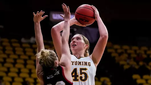 Nov 18, 2022; Laramie, WY, USA; Wyoming Cowgirls center Allyson Fertig (45) against the Denver Pioneers at Arena-Auditorium. Mandatory Credit: Troy Babbitt-UW Media-Athletics