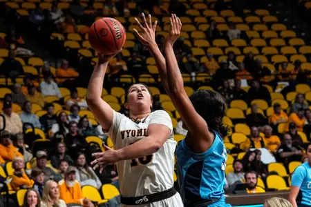 Oct 28, 2022; Laramie, WY, USA; Wyoming Cowgirls forward Marta Savic (15) shoots against the Colorado Christian Cougars at Arena-Auditorium. Mandatory Credit: Troy Babbitt-UW Media-Athletics