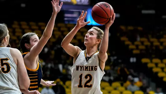Nov 22, 2022; Laramie, WY, USA; Wyoming Cowgirls guard Malene Pedersen (12) against the Regis Rangers at Arena-Auditorium. Mandatory Credit: Troy Babbitt-UW Media-Athletics