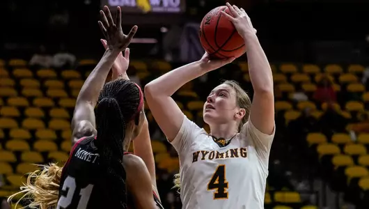 Nov 18, 2022; Laramie, WY, USA; Wyoming Cowgirls forward Grace Ellis (4) against the Denver Pioneers at Arena-Auditorium. The Cowgirls beat the Pioneers 68-45. Mandatory Credit: Troy Babbitt-UW Media-Athletics