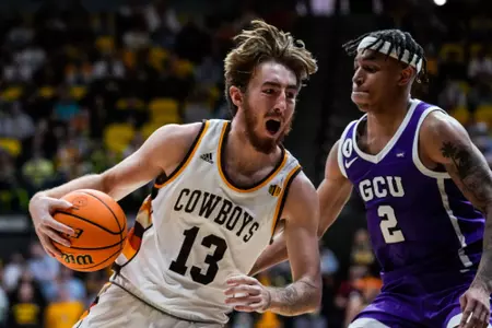 Dec 3, 2022; Laramie, WY, USA; Wyoming Cowboys forward Jake Kyman (13) against the Grand Canyon Antelopes at Arena-Auditorium. Mandatory Credit: Troy Babbitt-UW Media-Athletics