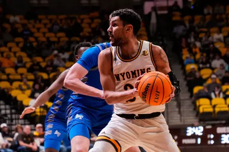 Feb 17, 2023; Laramie, WY, USA; Wyoming Cowboys guard Hunter Maldonado (24) against the Air Force Falcons at Arena-Auditorium.Mandatory Credit: Troy Babbitt-UW Media-Athletics