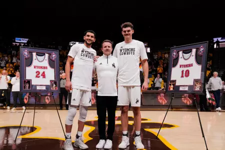 Feb 27, 2023; Laramie, WY, USA; Wyoming Cowboys guard Hunter Maldonado (24) head coach Jeff Linder and forward Hunter Thompson (10) against the Nevada Wolf Pack at Arena-Auditorium.Mandatory Credit: Troy Babbitt-UW Media-Athletics