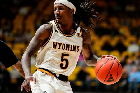 Feb 22, 2025; Laramie, WY, USA; Wyoming Cowboys guard Obi Agbim (5) against the San Jose State Spartans at Arena-Auditorium. Mandatory Credit: Troy Babbitt-UW Media-Athletics