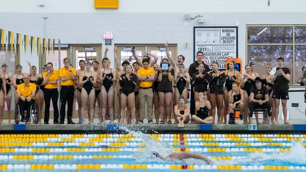 Swim & Dive cheering on the 200 Free Relay from the pool deck