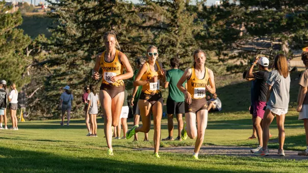 Hailey Uhre, Claire Engelhardt and Muriel Jones running at the Wyoming Invite