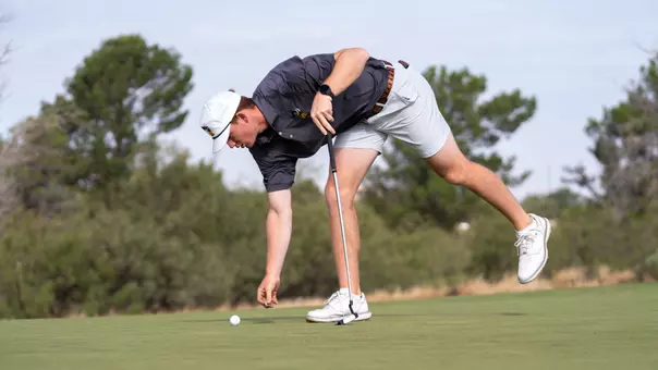 Leid marks his ball during the Final Round of the Tall City Classic