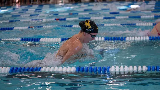 Taylor Craft swimming the breaststroke at the Front Range Invite