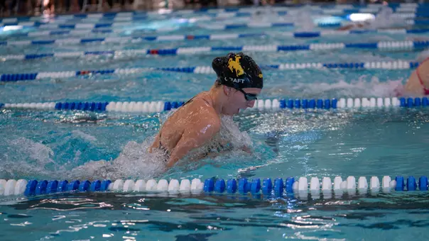 Taylor Craft swimming the breaststroke at the Front Range Invite