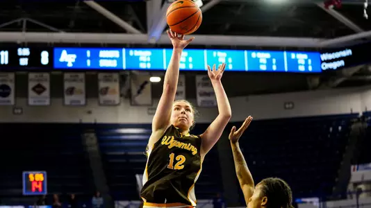 Feb 25, 2026; USAFA, Colorado Springs, CO, USA; Wyoming Cowgirls guard Malene Pedersen (12) against the Air Force Falcons at Clune Arena. Mandatory Credit: Troy Babbitt-UW Media-Athletics