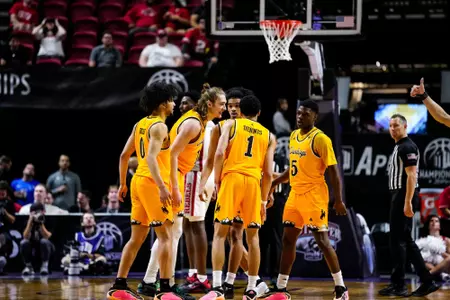 Cowboys huddle during the MW Tournament in 2026