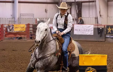 UW’s Layni Stevens prepares to round a barrel during the Eastern Wyoming College rodeo last weekend in Torrington. The St. Lawrence, S.D., senior won the event and the all-around title to lead the Cowgirls to the team title. (Kristin Bullard Photo)