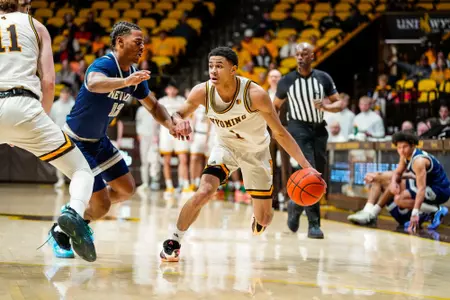 Mar 3, 2026; Laramie, WY, USA; Wyoming Cowboys guard Damarion Dennis (1) against the Nevada Wolf Pack at Arena-Auditorium. The Cowboys beat the Wolf Pack 83-73. Mandatory Credit: Troy Babbitt-UW Media-Athletics