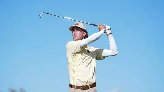 Conner Scheich watches an approach shot during Day 2 of the Cowboy Classic in Maricopa, Arizona