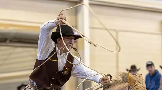 UW’s Traven Sharon won the men’s all-around at last weekend’s Skyline Stampede, hosted by Colorado State University. The Ordway, Colo., freshman won the tie-down roping competition and then placed second in the saddle bronc riding average to lead the Cowboys to the team title. (Kristen Bullard Photo)