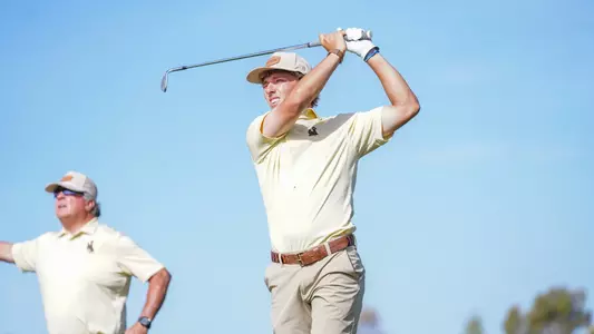 Brody Knowlton eyes his approach shot during Round 3 of the Cowboy Classic