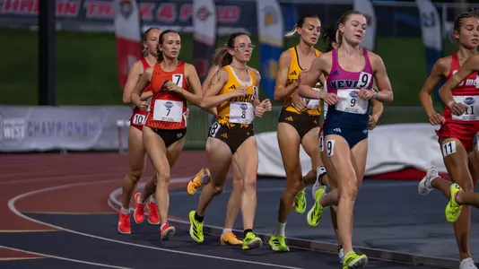 Eowyn Dalbec, alongside Marina Trave, running in the 10,000 meters at the 2026 MW Outdoor Championships