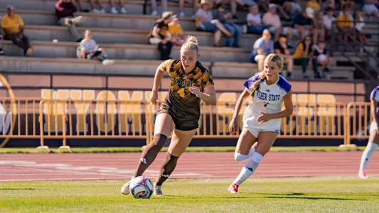 Maddie Burr handles the ball against Weber State at the Madrid Sports Complex on Thursday, Aug. 20