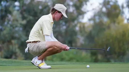 Conner Scheich lines up a putt during the 2026 Cowboy Classic