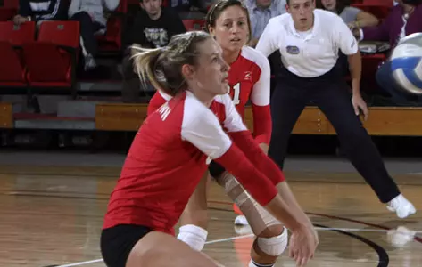 Brittany Grove digs a volleyball