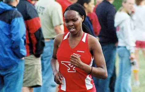 A YSU Cross Country runner runs