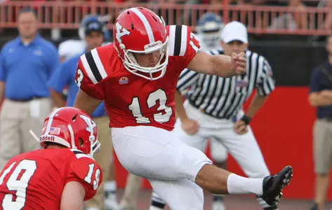 Stephen Blose kicks a football