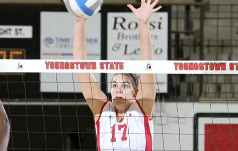 Haley Kapferer blocks a volleyball