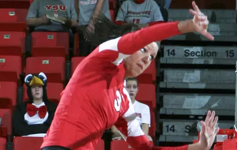 Kelsi Bitter swings at a volleyball