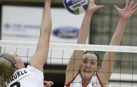 Tasha Reid Blocks a volleyball