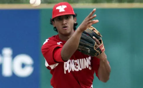 David Leon throws a baseball from the infield