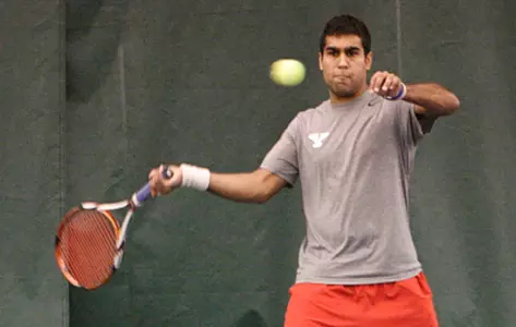 Tariq Ismail hits a forehand shot