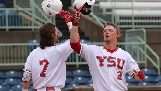 Trey Bridis and Jeff Wehler celebrate a home run