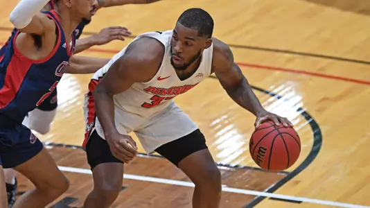 Men's Basketball Defeats UIC, 85-77, on Historic Night Image