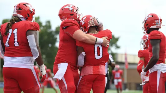 Bryce Oliver celebrates a touchdown catch against Dayton