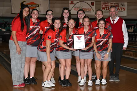 The YSU bowling team collects its third-place trophy at the 2024 Penguin Classic