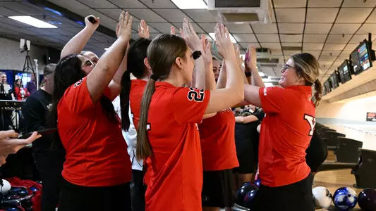 Alivia Baskin high fives her teammates after a strike as Youngstown State's bowling team beat Vanderbilt at the 2025 Chelsea Gilliam Penguin Classic on Oct. 19, 2025.