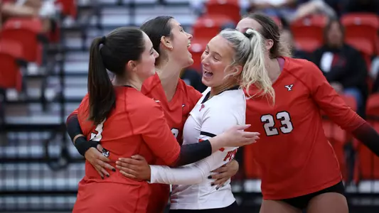 Maria Insana, Layne Graffice, Brie Habeeb and Abbie Householder celebrate a point in the Youngstown State volleyball team's win over NKU on Oct. 4, 2025. Photo by Bryson Chavez.