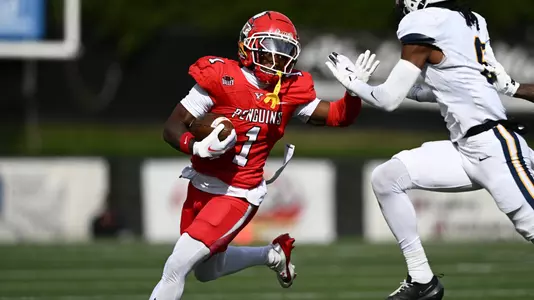 Flash Wilson with a stiff arm of a Murray State defender