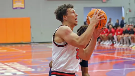 Rich Rolf drives in for a layup against Georgia Southern at the Jacksonville Classic
