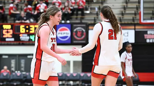 Sarah Baker and Sophia Gregory high five at midcourt during Youngstown State's women's basketball game against Toledo on Nov. 25, 2025.
