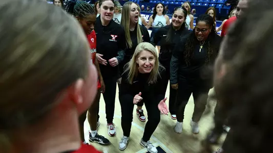 Head Women's Basketball Coach Melissa Jackson celebrates in the team huddle as YSU beat Akron 90-63 on Nov. 30, 2025. Photo by Robert Hayes.